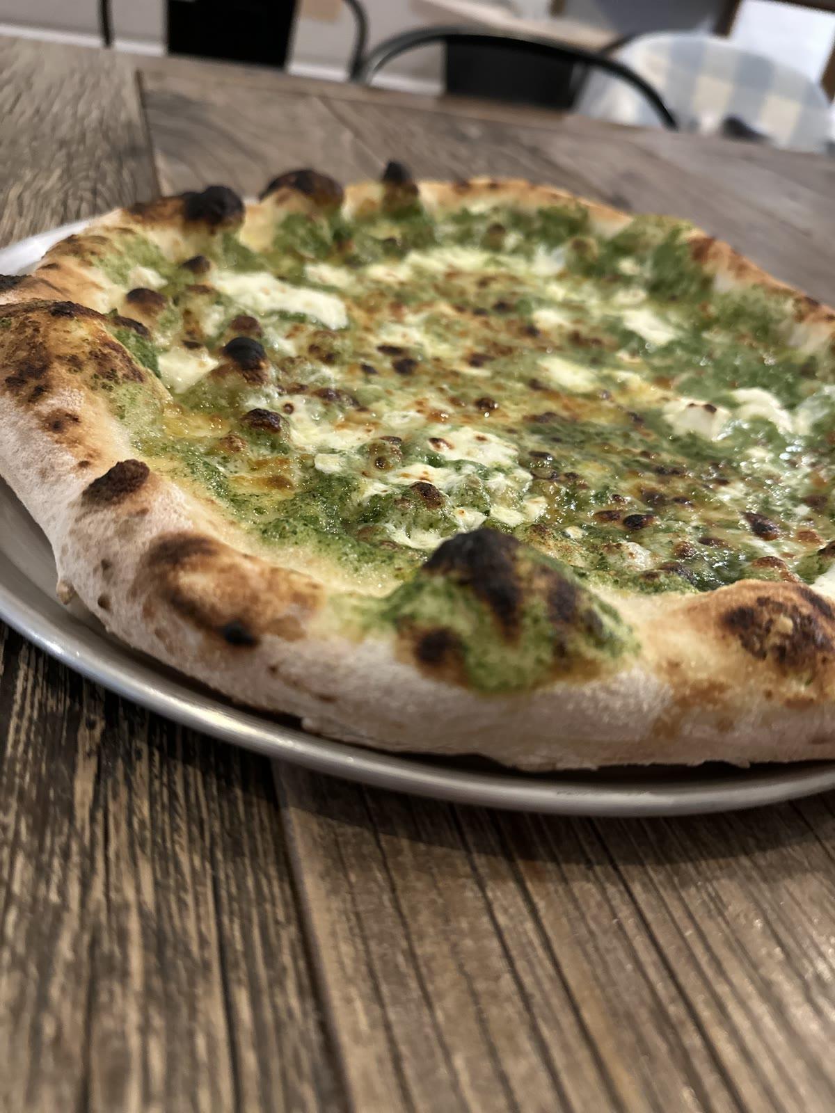 Pesto pizza fresh from the wood oven at Tillage