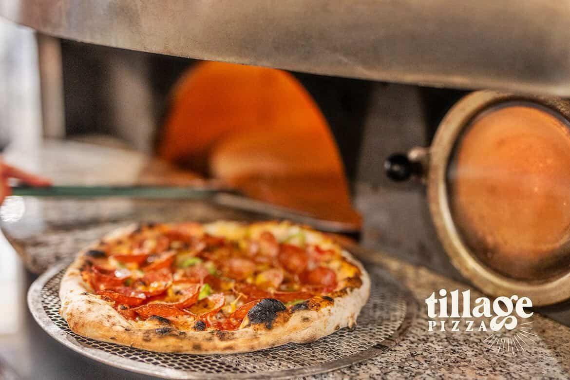 Wood-fired pizza fresh from the oven at Tillage